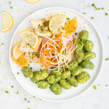 dinner in a lactose-free box diet - baked sole with citrus, potato gnocchi in spinach sauce, vegetable julienne with carrot and parsley